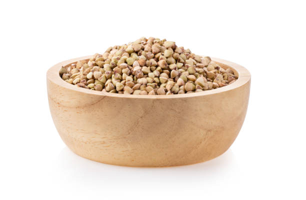 istock Buckwheat in wood bowl on the white background 1329303909