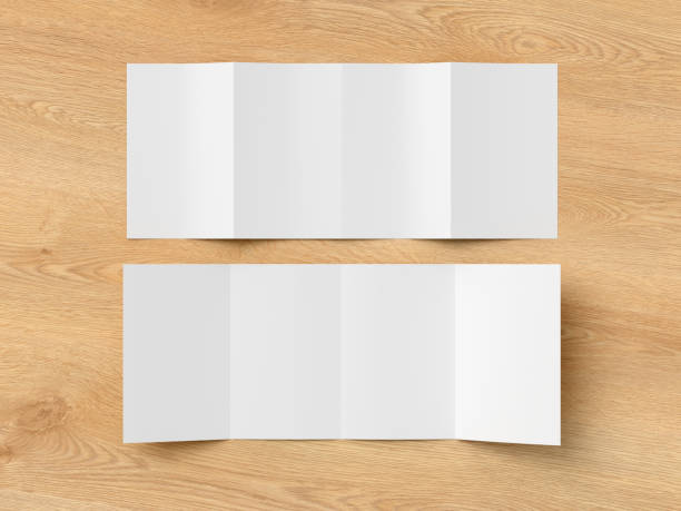 istock Vertical double gate fold brochure. Four panels, eight pages blank leaflet. Mock up on wooden background for presentation design. Front and back side. 1329304650