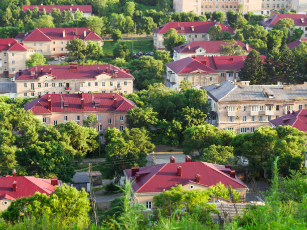 istock Town view from above. Group of houses with red roofs. 1329305607