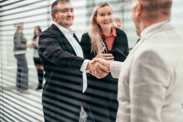 istock through the blinds. an entrepreneur meets his business partner 1329307291
