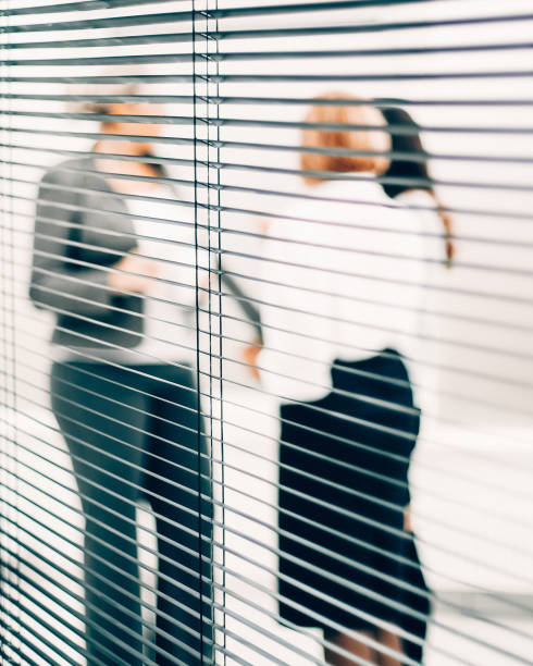 istock close up. qualified employees discussing business documents 1329307302