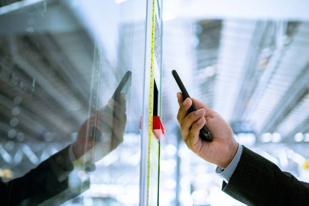 Asian man paying with smartphone to vending machine. Asian businessman paying with smartphone to vending machine. contactless airport stock pictures, royalty-free photos & images