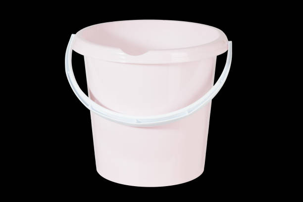 istock pink plastic cleaning bucket isolated on black background 1329309780