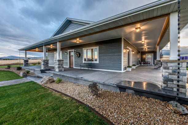 istock Large wrap-around porch with rain chain and stone pillars 1329309996