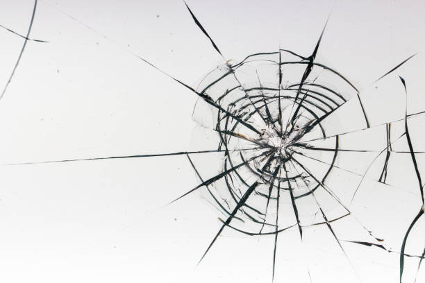 istock Cracks on the glass on a white background. 1329311774