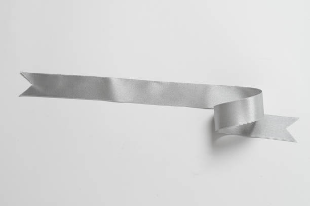 istock A roll silver ribbon isolated on white background 1329315620