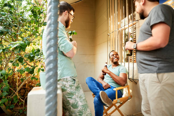 istock Group of friends talking over beers at backyard part 1329316783