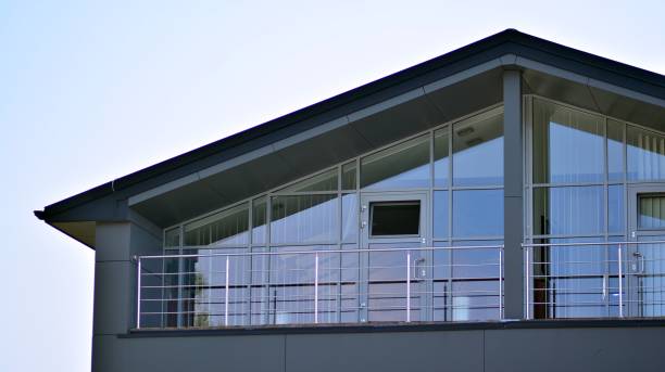 istock The glazed facade of an office building with reflected sky. 1329317681