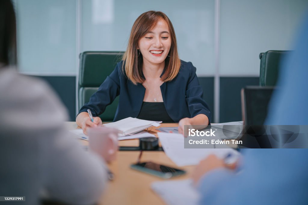 asian chinese successful businesswoman meeting discussion with her colleague client on investment insurance real estate Financial Advisor Stock Photo