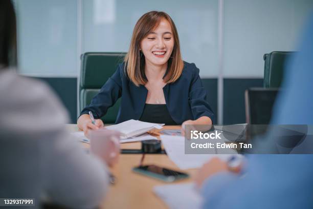 Asian Chinese Successful Businesswoman Meeting Discussion With Her Colleague Client On Investment Insurance Real Estate Stock Photo - Download Image Now