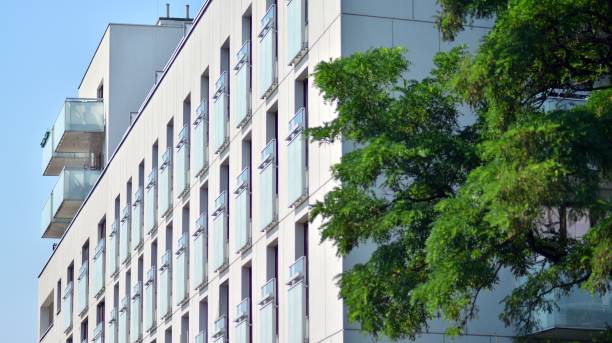 istock Eco architecture. Green tree and apartment building. 1329318943