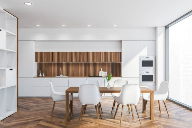 istock Dining table in white and wooden kitchen interior 1329319174