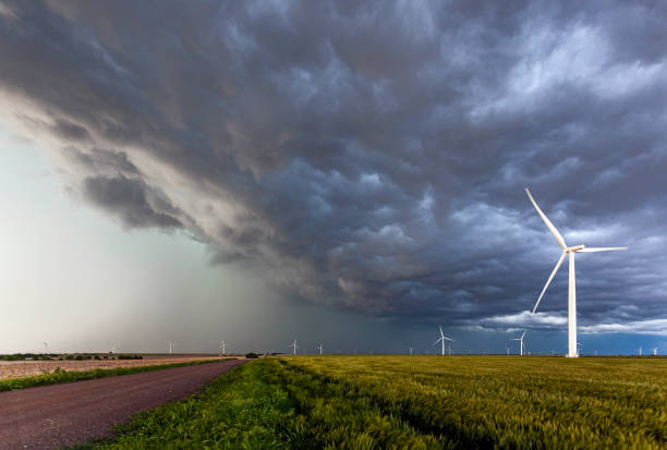 istock Dark black clouds from severe storm blanket wind turbines 1329323435