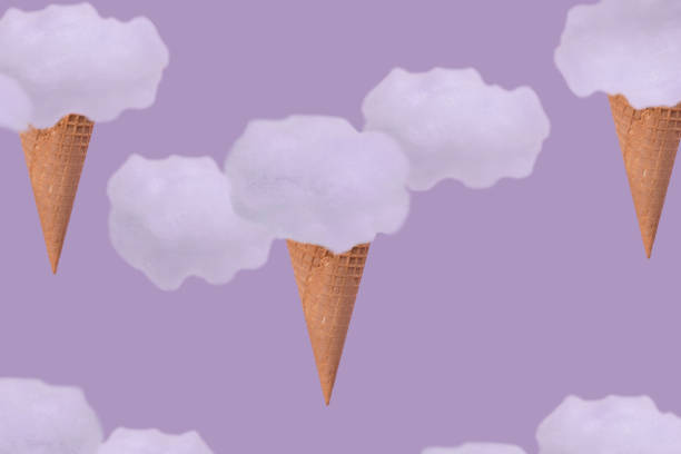istock Ice cream cone and fluffy clouds on a purple background. 1329325924