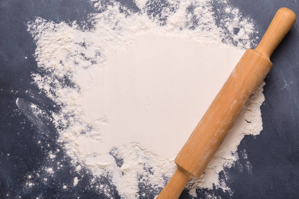 istock Baking or cooking background, flour on the dark background 1329328900