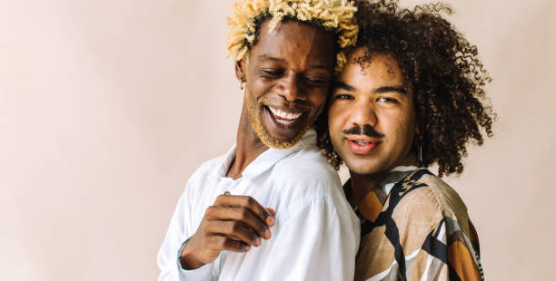 istock Beautiful gay couple standing in a studio 1329330903