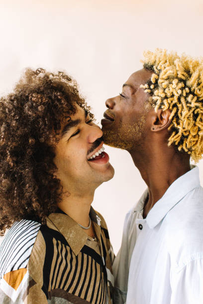 istock Romantic gay couple posing in a studio 1329330911
