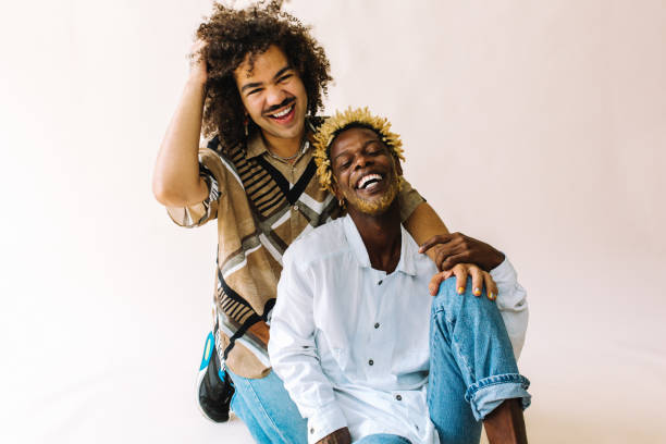 istock Confident gay couple smiling cheerfully in a studio 1329330913