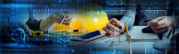 istock Engineers or architects is watching on model building and blueprint in working site.Construction and structure concept. 1329334639
