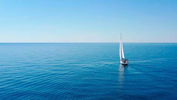 aerial view of sailing luxury yacht at opened sea at sunny day in croatia - recreatieboot stockfoto's en -beelden