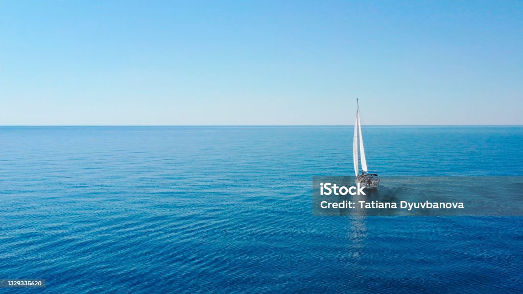 Aerial view of sailing luxury yacht at opened sea at sunny day in Croatia Aerial view of sailing luxury yacht at opened sea at sunny day in Croatia, view from drone Sea Stock Photo