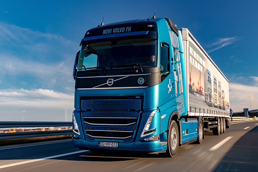 Zagreb, Croatia - December 07, 2020 - Brand new Volvo FH500 I-Save driving fast on a motorway. I-Save lets you drive at lower revs and higher gear for a longer time with 10% less fuel consumption.