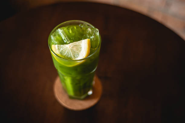 istock Green tea and lemon soda. Beverage for summer with brick wall background. 1329336607