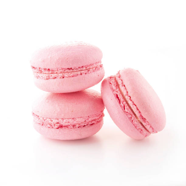 istock Three pink French macarons on an isolated background. 1329337670