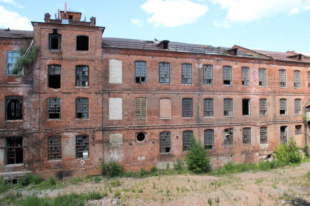 istock View from window of  old abandoned red brick building on another wall in backyard in sunny summer day 1329340844