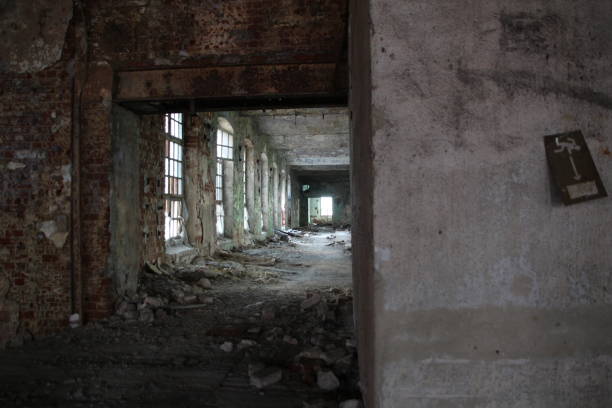 istock Corridor with windows in old abandobed factory 1329341057