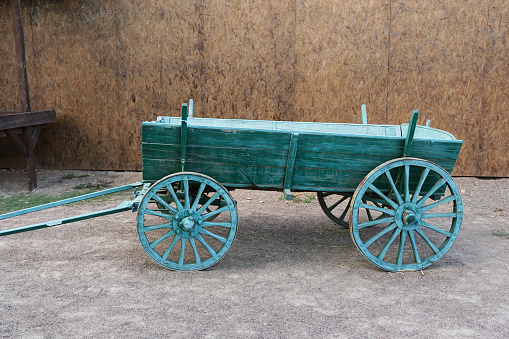 old blue wooden wheelbarrow on the farm
