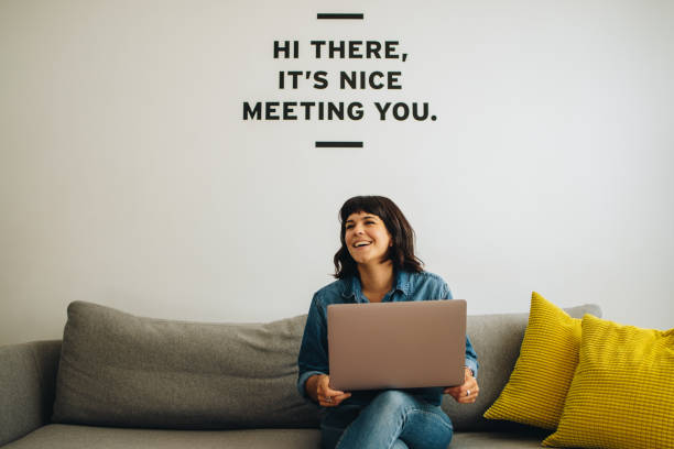 istock Smiling executive at lobby with laptop 1329347042