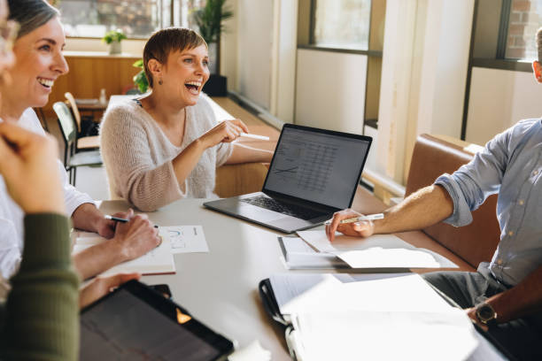 istock Smiling businesswoman in project discussion 1329347054