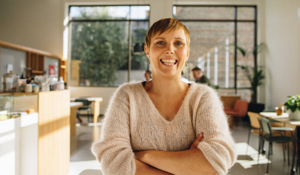 istock Confident female executive standing in office 1329347196