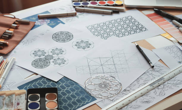 istock Designer designing drawing sketch pattern geometric flower seamless wallpaper fabric textile fashion industry. artistic design studio. 1329347897