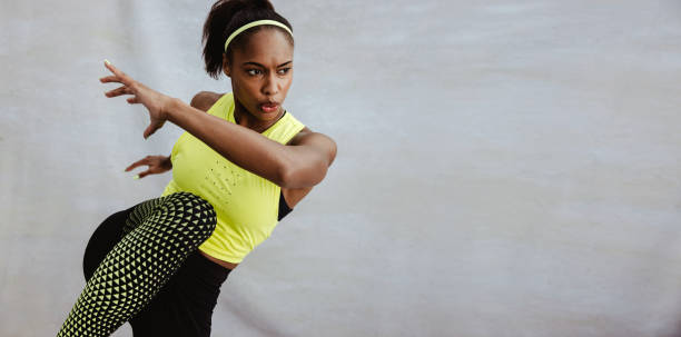 istock Young African woman doing stretching exercise 1329347959
