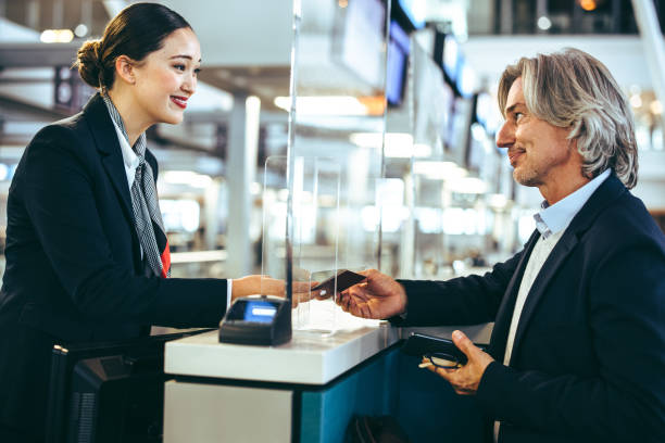 istock Businessman doing check in at airline check-in counter 1329348344