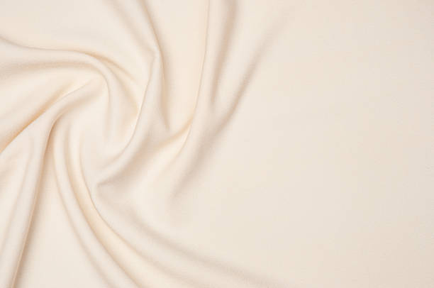 istock Smooth elegant ivory tissue abstract background. Textile background. Cloth wallpaper. Graphics design element 1329350605