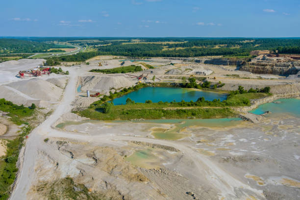 istock Small lakes formed by mining activities on stone extraction in the canyon 1329352718