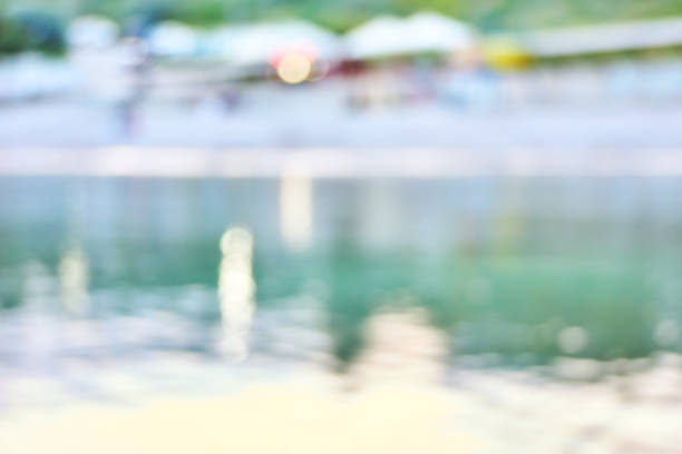 Summer seaside resort blurry view background with bokeh lights