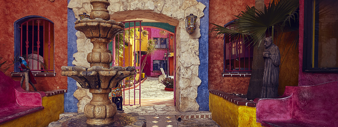 A colorful courtyard with a marble fountain in the foreground: an example of South American architecture. Banner image.