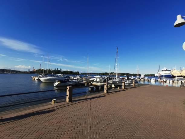 Evening mood in summer in Helsinki, in the harbor, view of icebreakers and boats