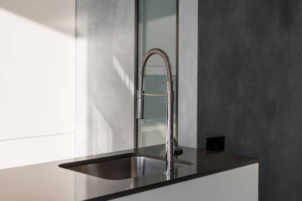 istock Kitchen counter with modern shiny faucet and sink 1329363990