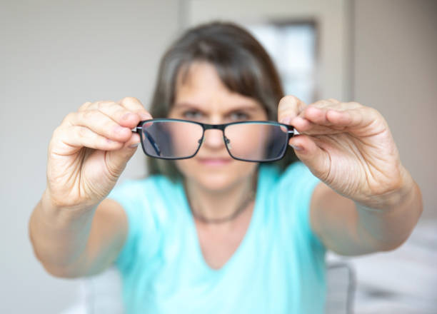 istock middle aged woman with poor eyesight 1329365056