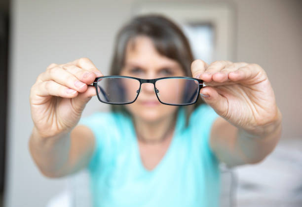 istock middle aged woman with poor eyesight 1329365059