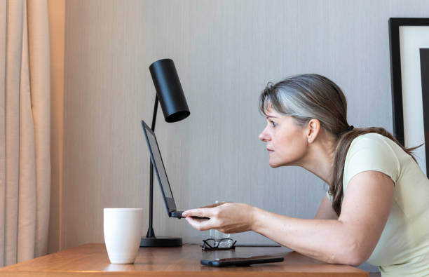 istock middl aged woman with poor eye sight 1329365327