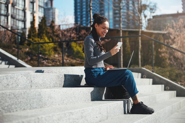 istock Joyous lady reading a text message on her cellular phone 1329366102