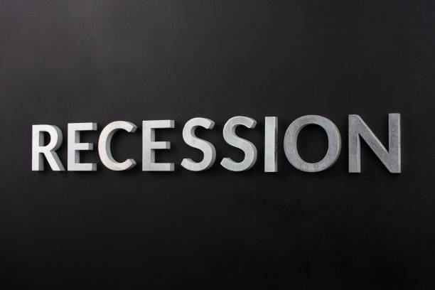 istock the word recession laid with white brushed metal letters on flat black surface 1329366259