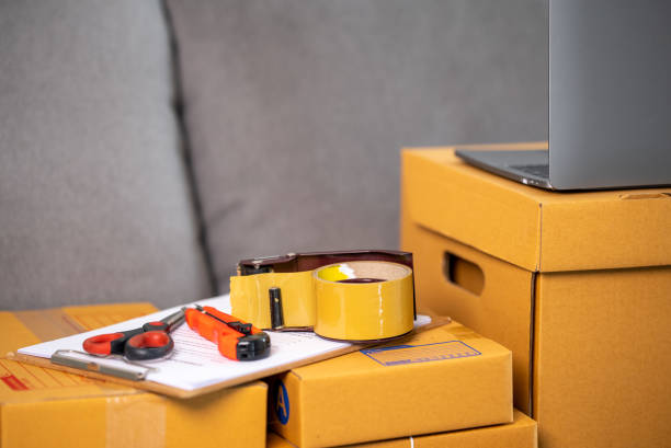 istock cardboard parcel box for online selling,Start up small business entrepreneur working online marketing packaging box delivery 1329366371