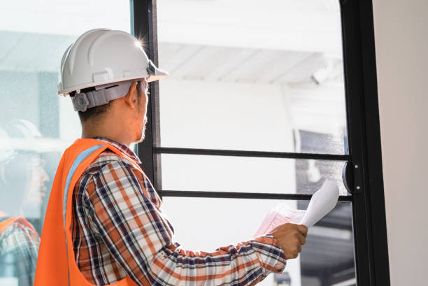 istock male engineer Working tools Engineer office desk with helmet at desk talbe 1329367350